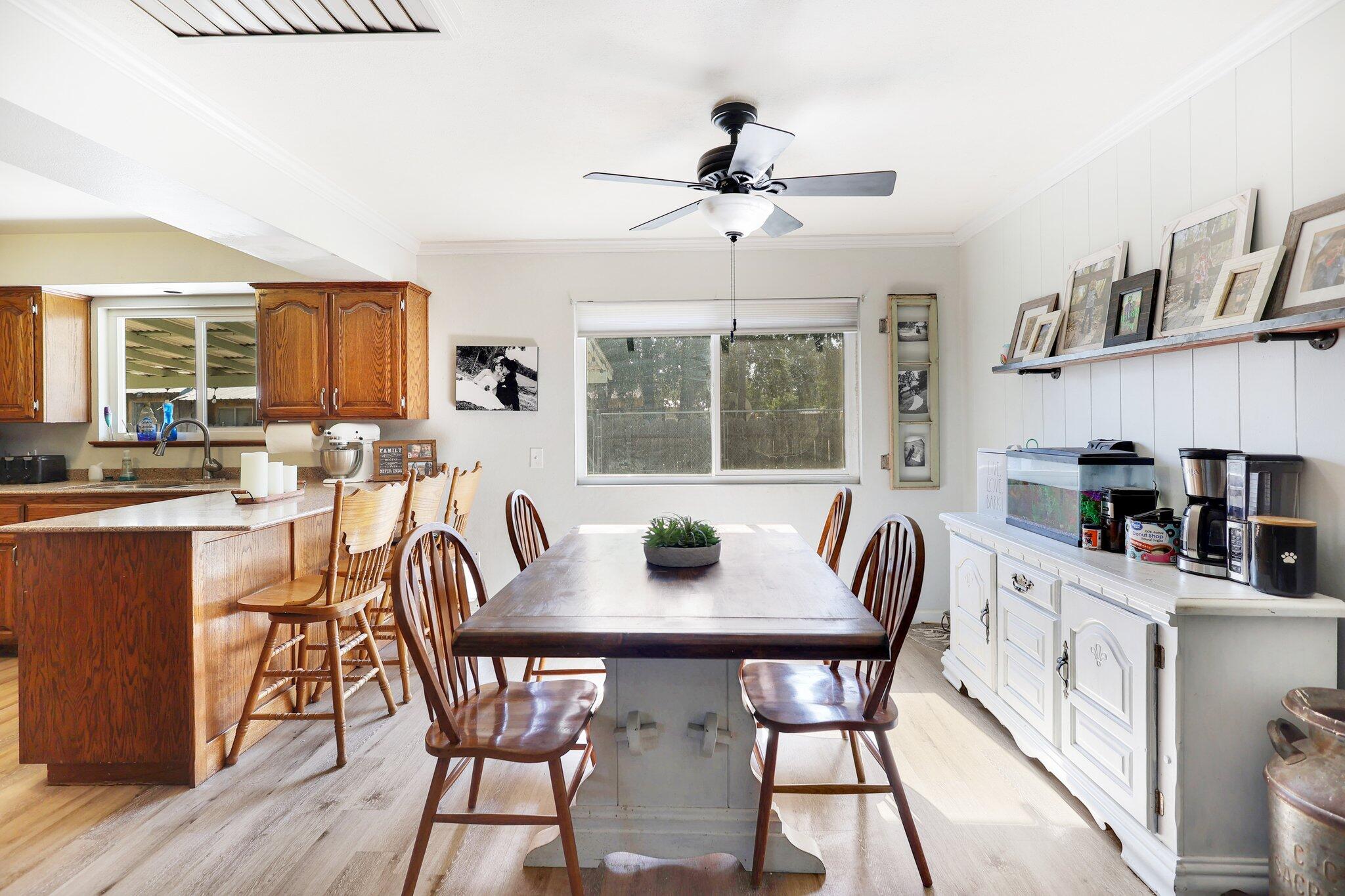 140 Chestnut Avenue Red Bluff, CA 96080 - Photo 5 of 26 a view of a dining room with furniture window and wooden floor