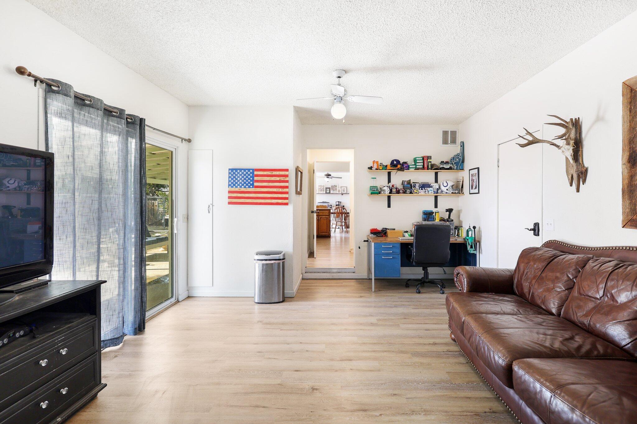 140 Chestnut Avenue Red Bluff, CA 96080 - Photo 10 of 26 a living room with furniture and a flat screen tv