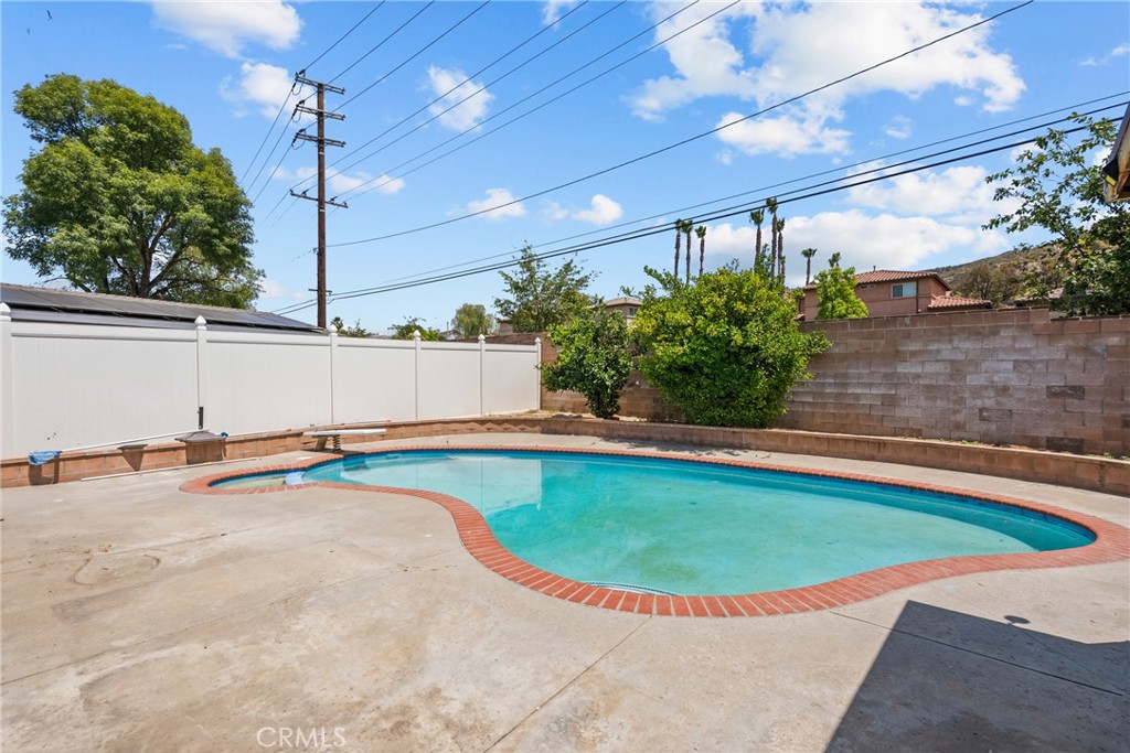 21124 Rosedell Drive Saugus, CA 91350 - Photo 14 of 14 a view of a swimming pool with a patio