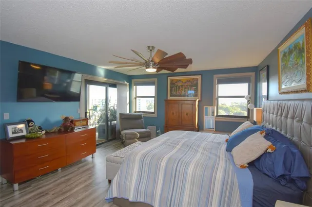 a bed room with a bed and a tv