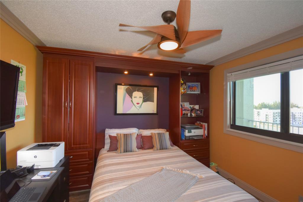 2238 North Cypress Bend Drive, Unit 902 Pompano Beach, FL 33069 - Photo 24 of 41 Murphy bed in second bedroom