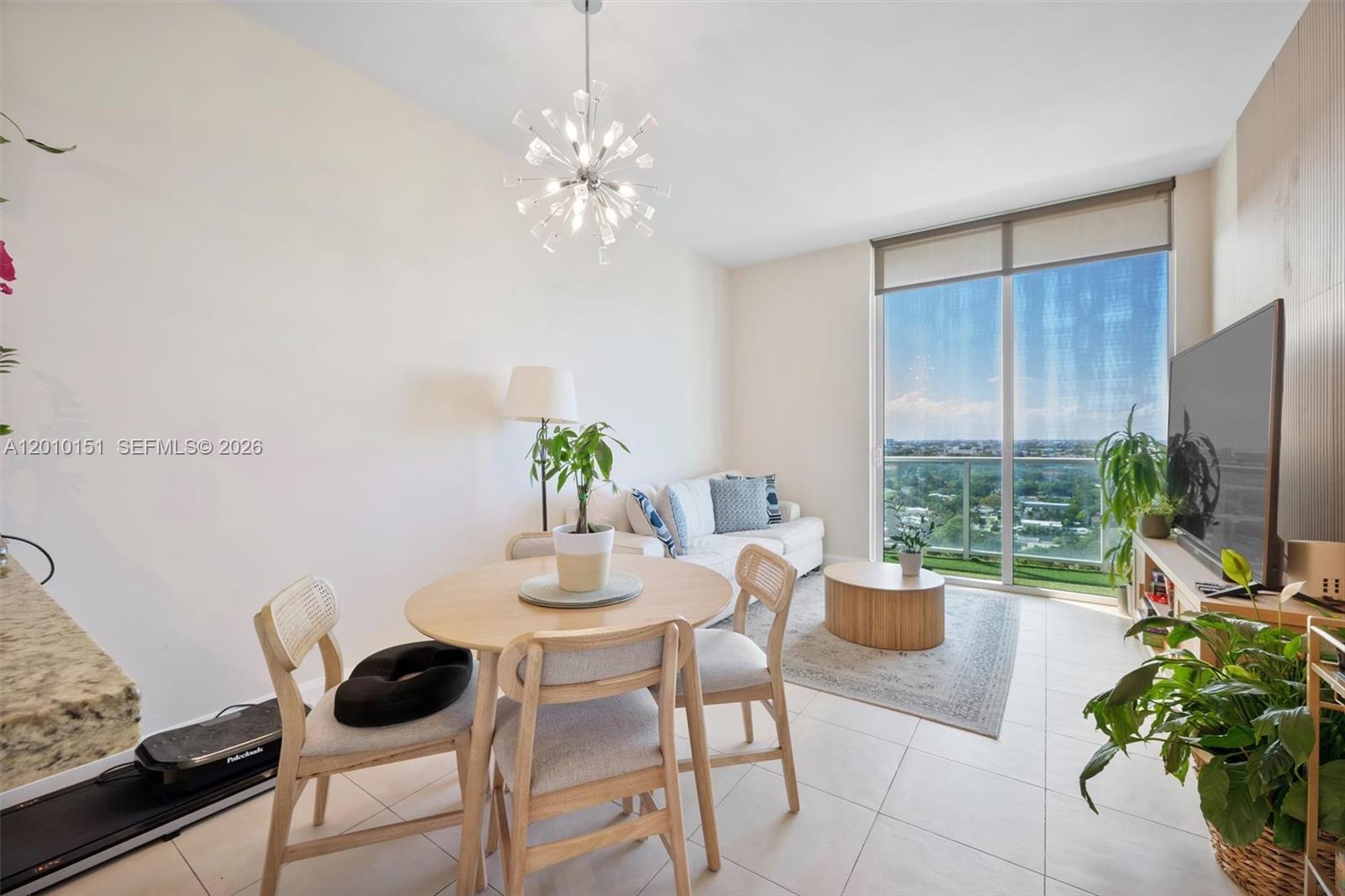 2525 Southwest 3rd Avenue, Unit 1603 Miami, FL 33129 - Photo 1 of 20 a view of a dining room with furniture window and outside view