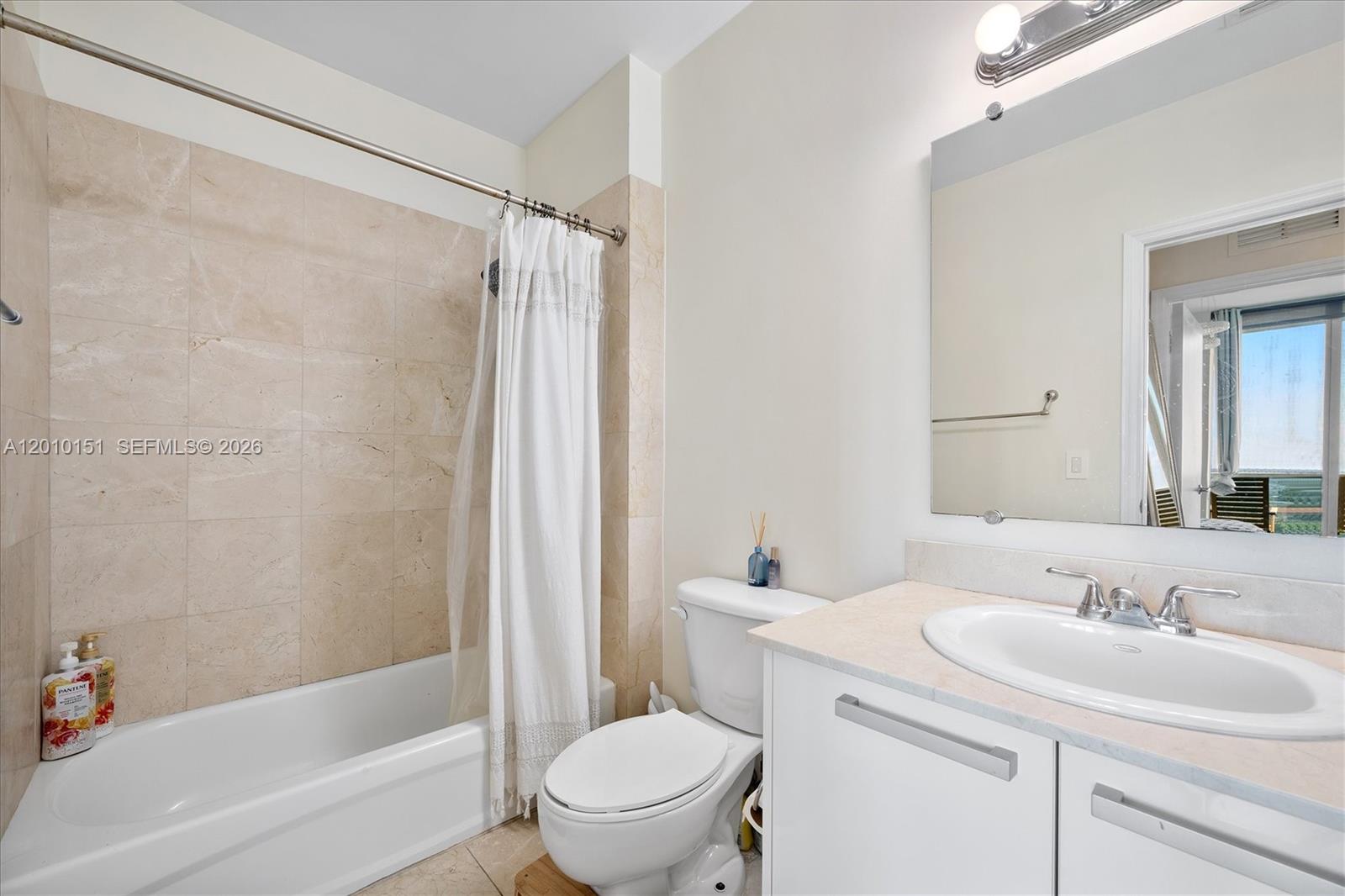 2525 Southwest 3rd Avenue, Unit 1603 Miami, FL 33129 - Photo 11 of 20 a bathroom with a sink toilet and shower