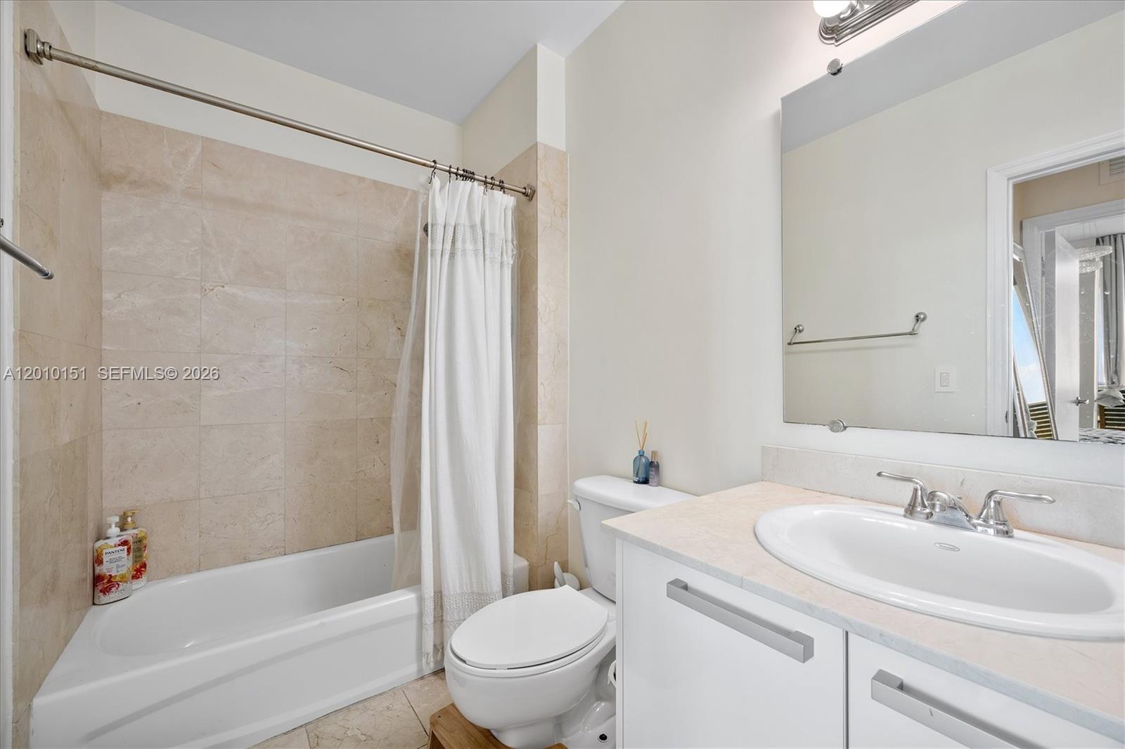 2525 Southwest 3rd Avenue, Unit 1603 Miami, FL 33129 - Photo 12 of 20 a bathroom with a sink toilet and shower