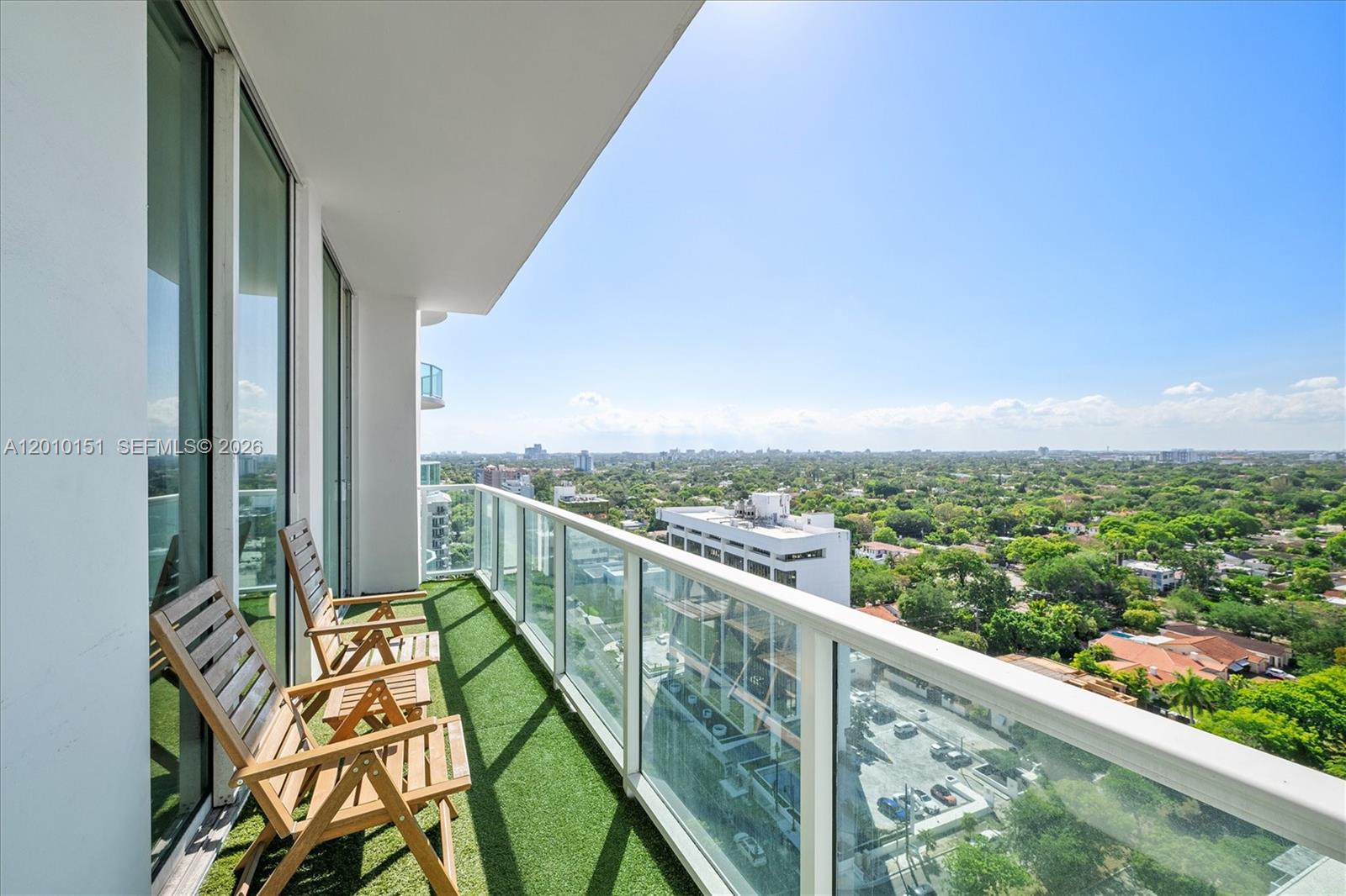 2525 Southwest 3rd Avenue, Unit 1603 Miami, FL 33129 - Photo 15 of 20 a view of a balcony with wooden floor and fence