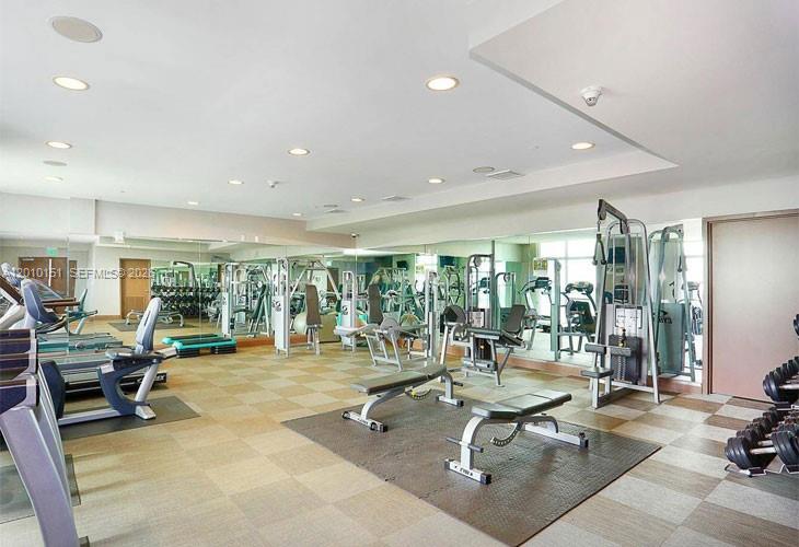 2525 Southwest 3rd Avenue, Unit 1603 Miami, FL 33129 - Photo 16 of 20 a playing room with lots of table and chairs
