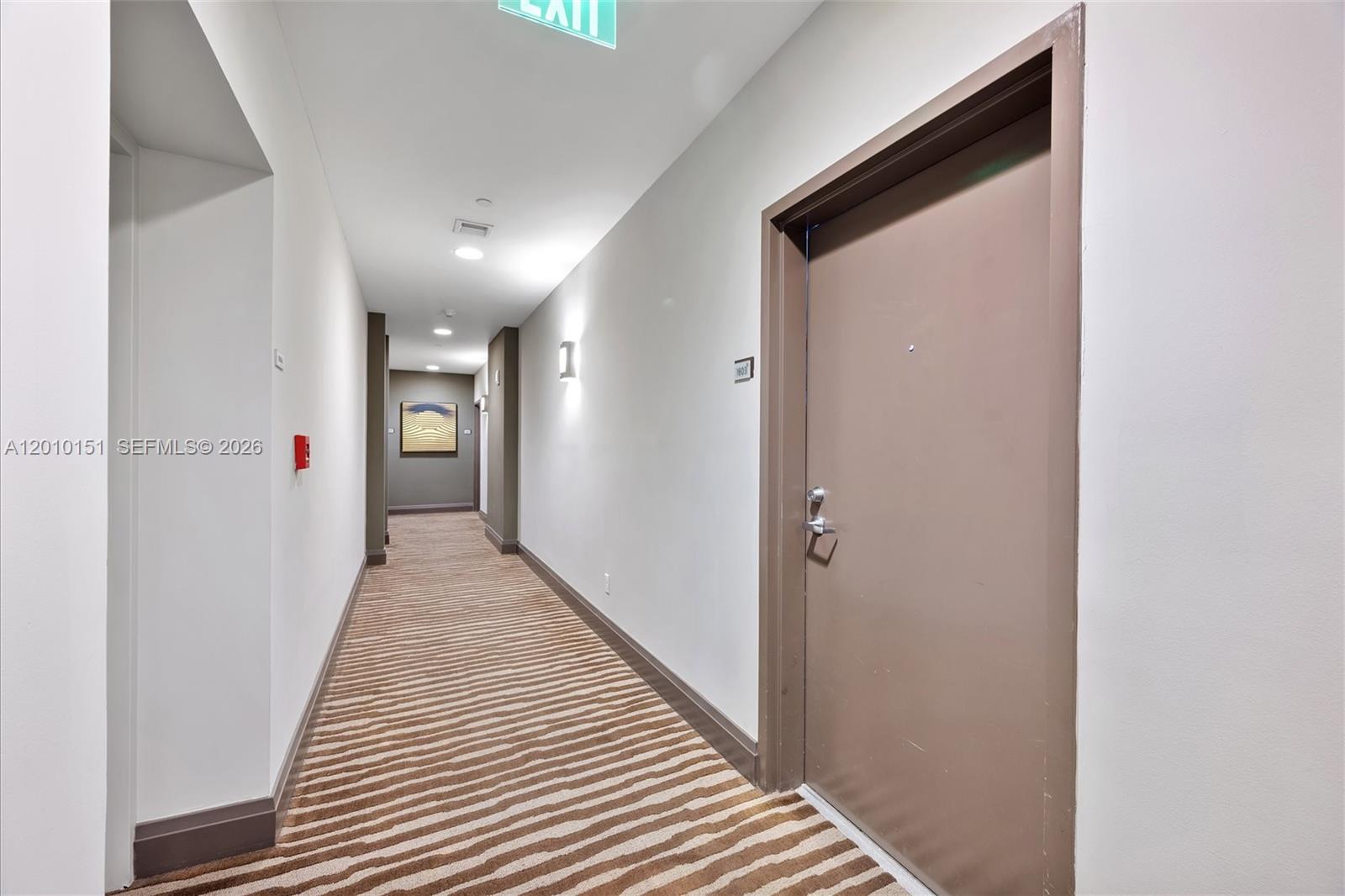 2525 Southwest 3rd Avenue, Unit 1603 Miami, FL 33129 - Photo 2 of 20 a view of a hallway with wooden floor