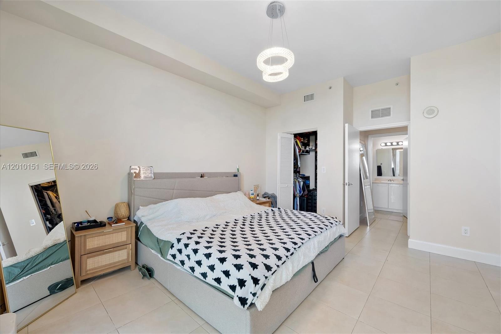 2525 Southwest 3rd Avenue, Unit 1603 Miami, FL 33129 - Photo 10 of 20 a bedroom with a bed and dresser