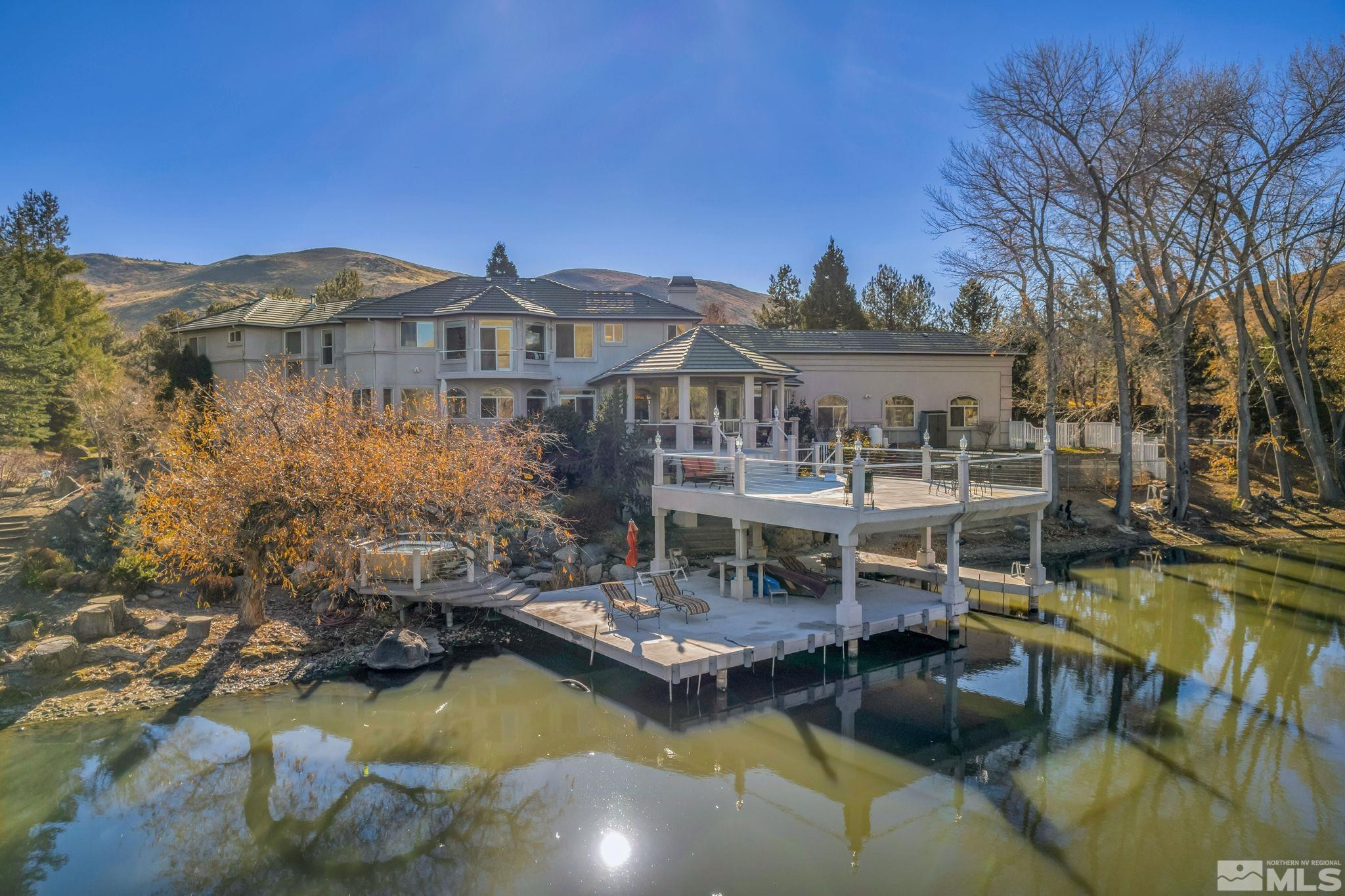 15 Hidden Lake Drive Reno, NV 89521 - Photo 1 of 40 a view of a building with a swimming pool and sitting area