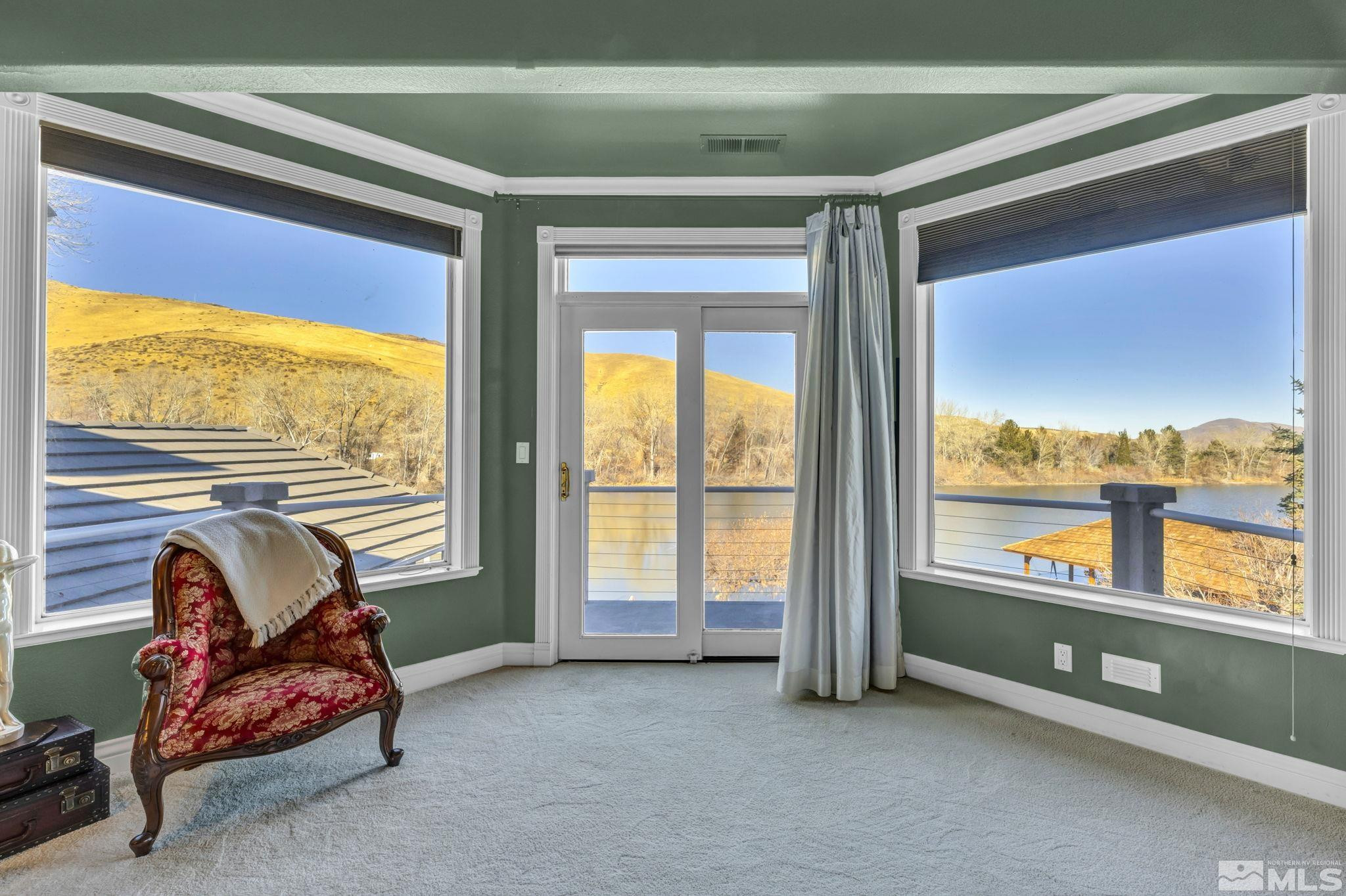 15 Hidden Lake Drive Reno, NV 89521 - Photo 13 of 40 a living room with furniture and a floor to ceiling window