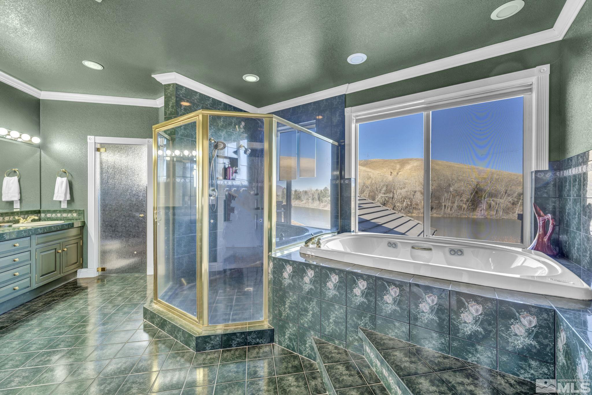 15 Hidden Lake Drive Reno, NV 89521 - Photo 17 of 40 a bathroom with a glass shower door and a glass door