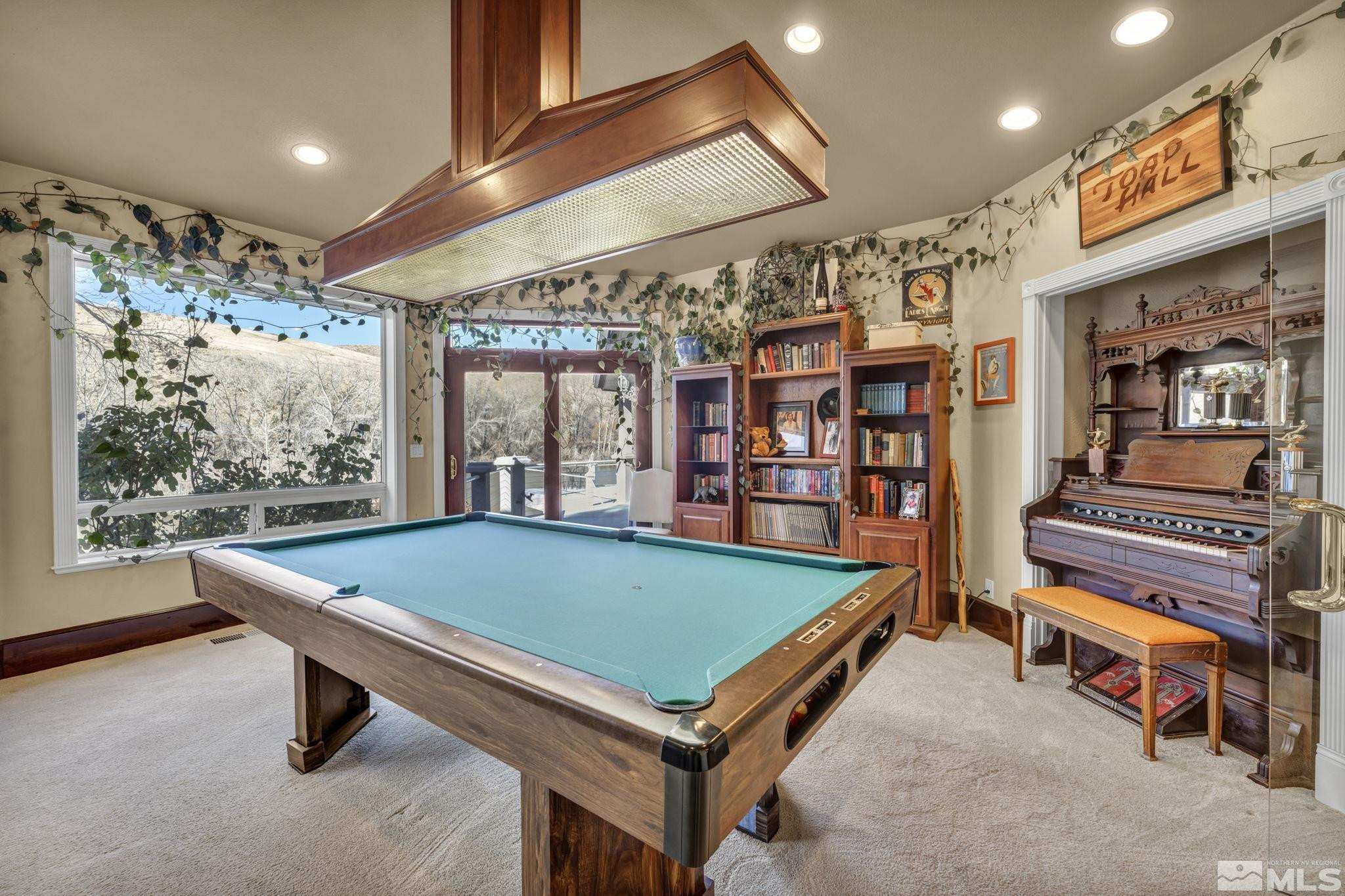15 Hidden Lake Drive Reno, NV 89521 - Photo 27 of 40 a room with pool table and windows