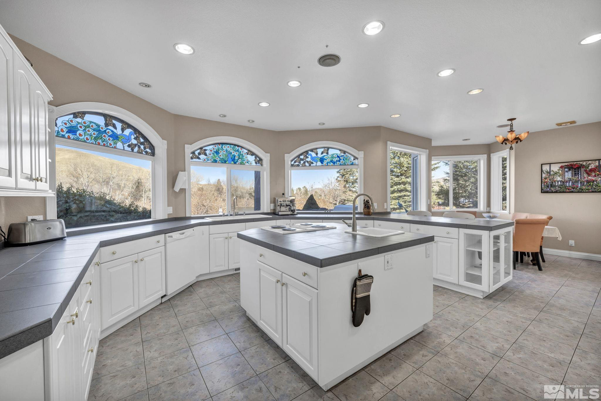 15 Hidden Lake Drive Reno, NV 89521 - Photo 28 of 40 a kitchen with stainless steel appliances granite countertop a stove and a sink