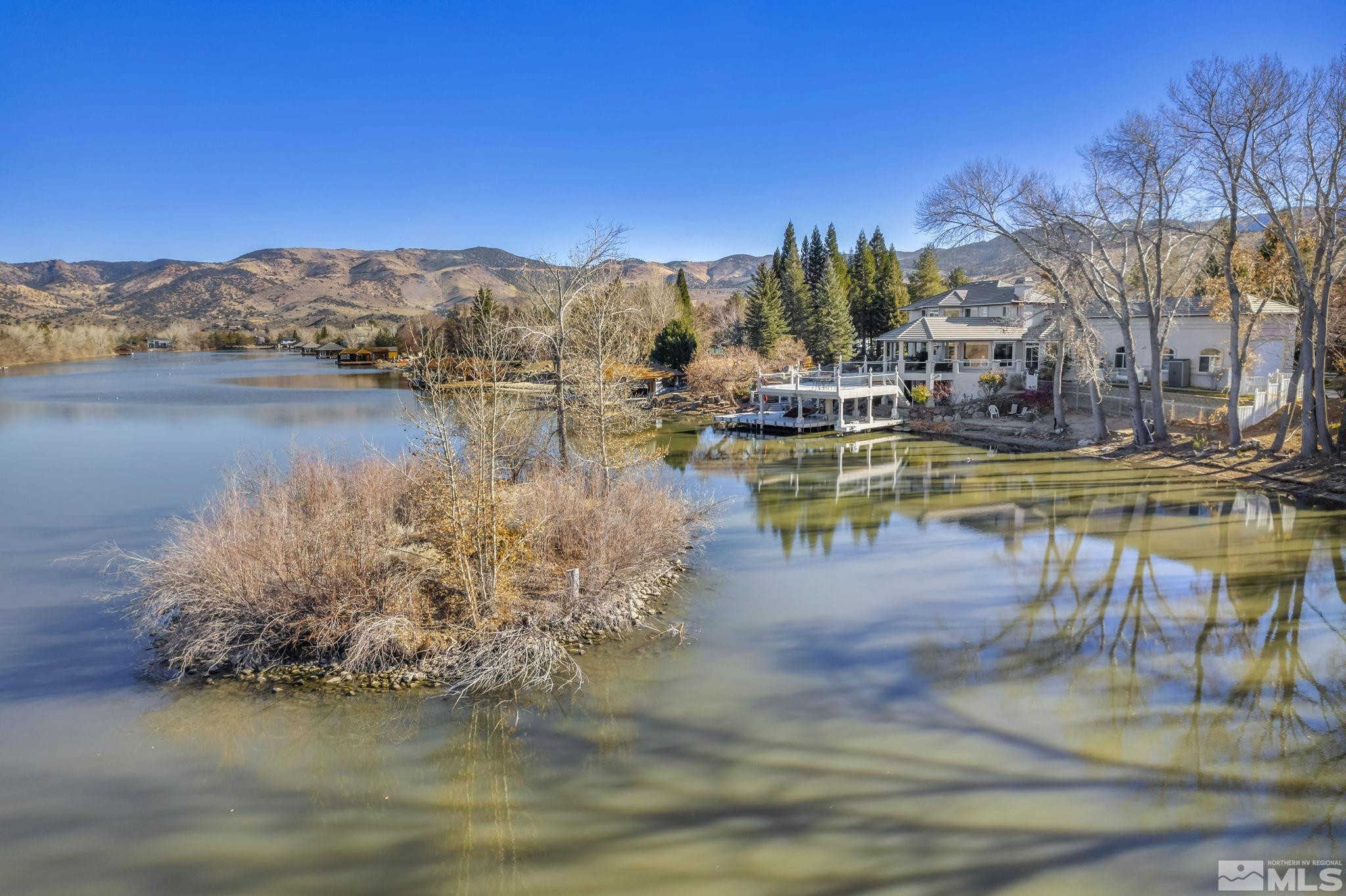 15 Hidden Lake Drive Reno, NV 89521 - Photo 38 of 40 a view of a lake with a mountain
