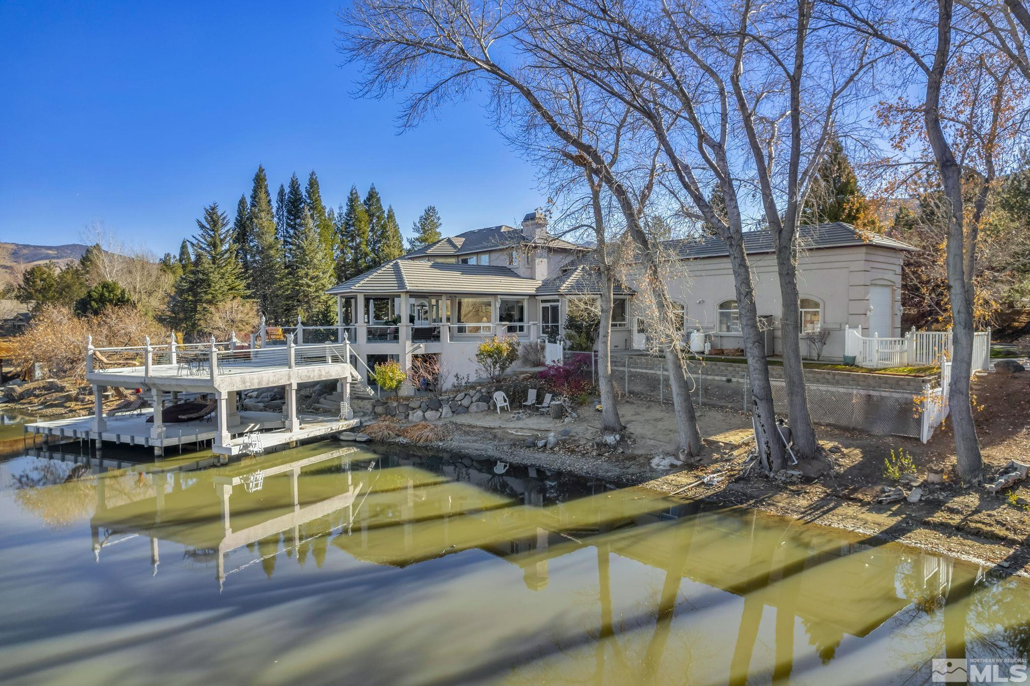 15 Hidden Lake Drive Reno, NV 89521 - Photo 8 of 40 a view of a swimming pool with a patio and a yard