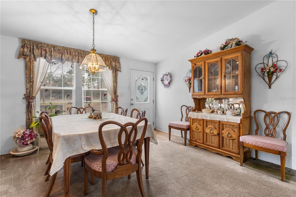 12251 Southeast 66th Place Morriston, FL 32668 - Photo 33 of 55 a view of a dining room with furniture window and outside view