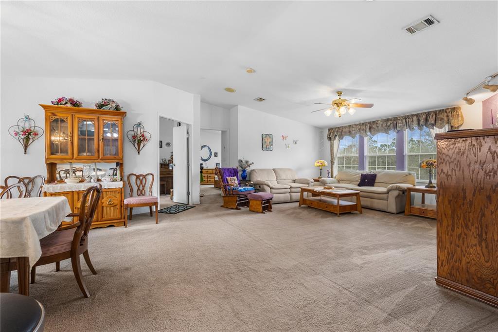 12251 Southeast 66th Place Morriston, FL 32668 - Photo 35 of 55 a living room with furniture and a flat screen tv