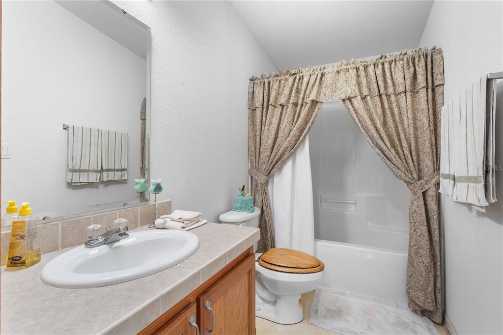 12251 Southeast 66th Place Morriston, FL 32668 - Photo 36 of 55 a bathroom with a sink toilet and shower