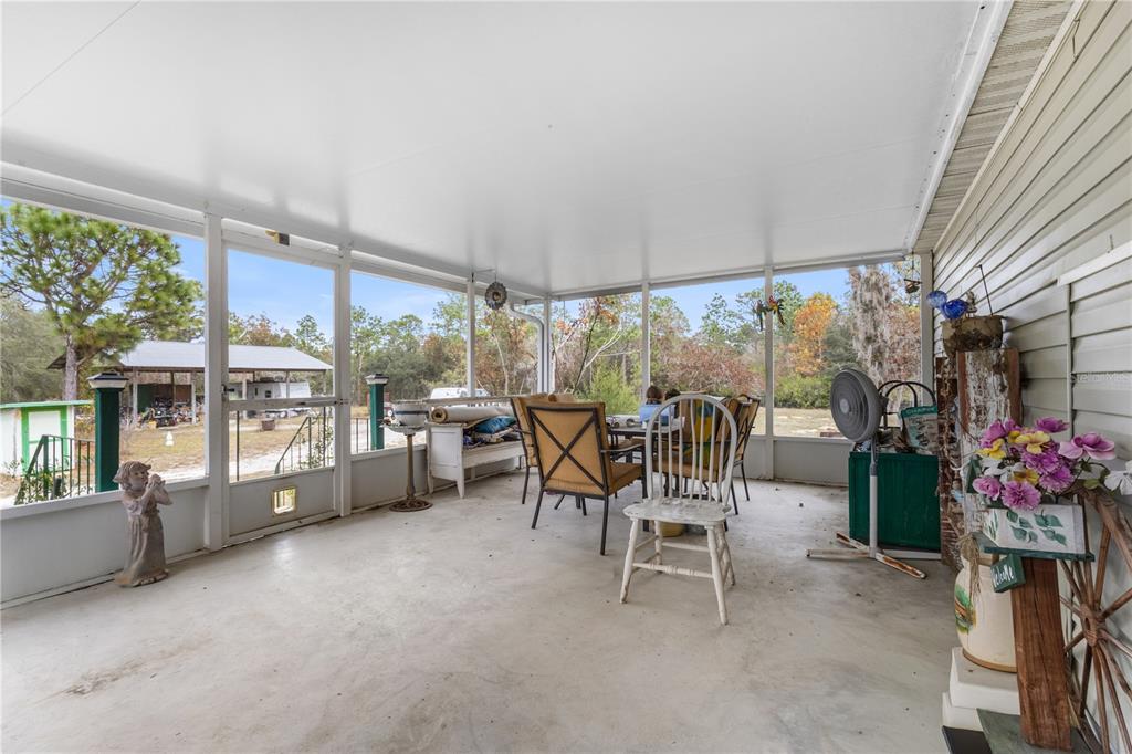 12251 Southeast 66th Place Morriston, FL 32668 - Photo 42 of 55 a view of a dining room with furniture window and outside view