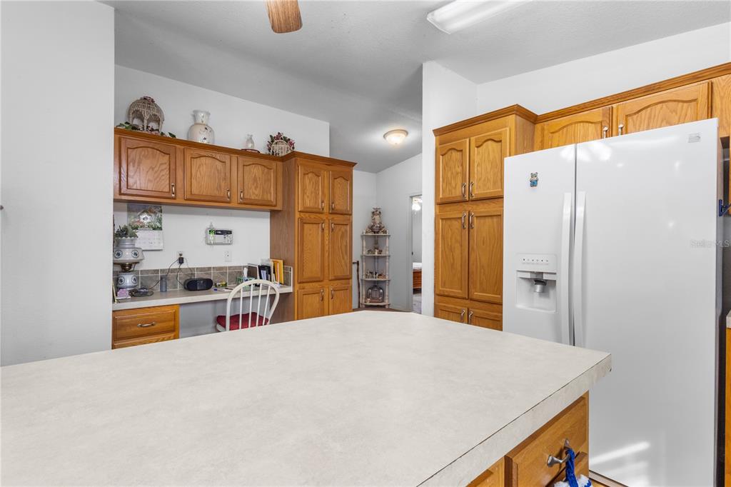 12251 Southeast 66th Place Morriston, FL 32668 - Photo 45 of 55 a bedroom with a bed and a refrigerator