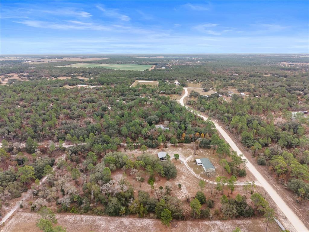 12251 Southeast 66th Place Morriston, FL 32668 - Photo 49 of 55 an aerial view of residential houses with outdoor space