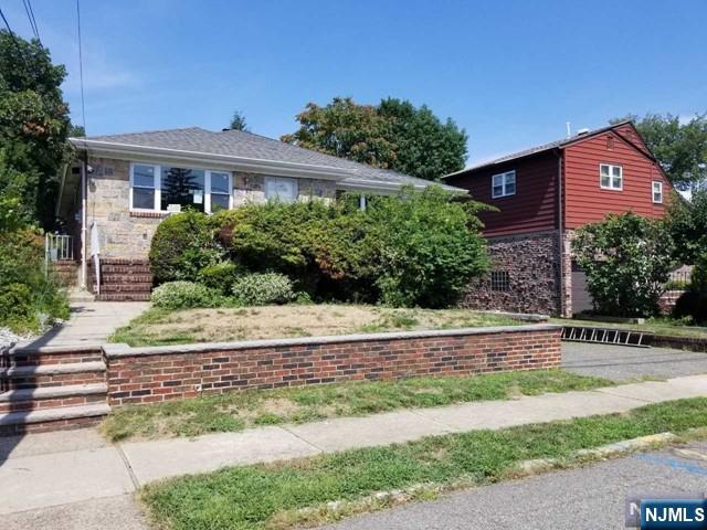 229 Mohegan Way Fort Lee, NJ 07024 - Photo 1 of 14 a view of a house with a yard