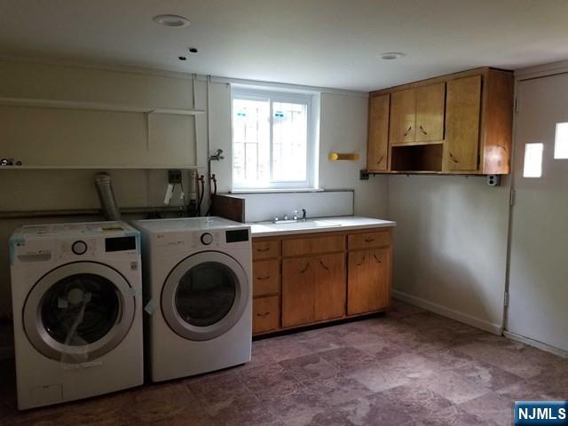 229 Mohegan Way Fort Lee, NJ 07024 - Photo 12 of 14 a utility room with sink dryer and washer