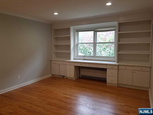 229 Mohegan Way Fort Lee, NJ 07024 - Photo 9 of 14 an empty room with wooden floor and windows