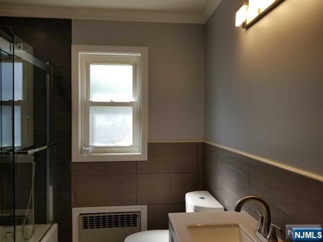 229 Mohegan Way Fort Lee, NJ 07024 - Photo 10 of 14 a bathroom with a window