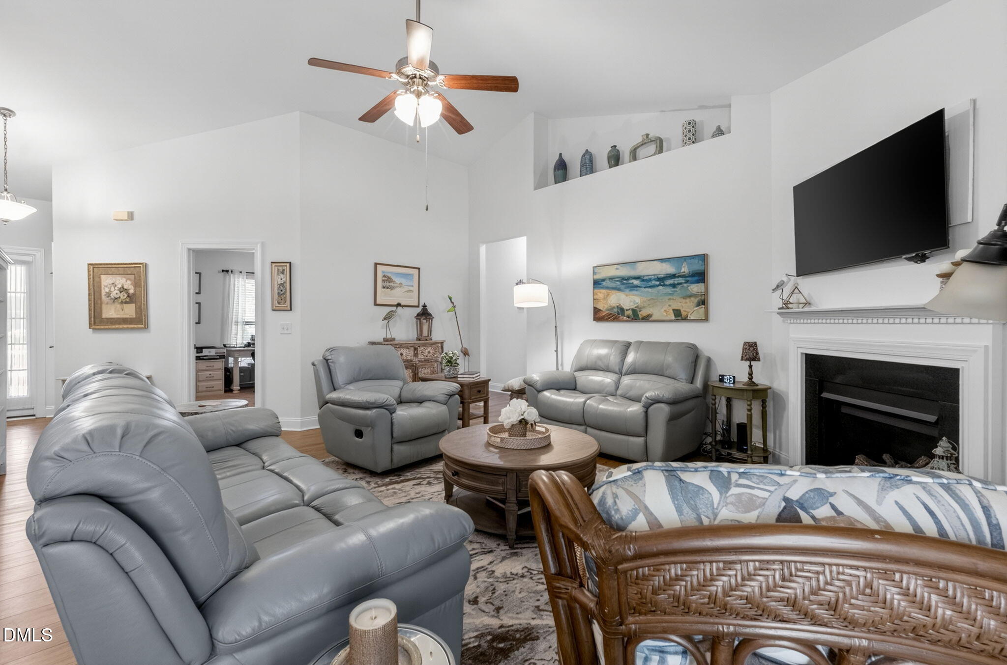 20 Deep Clay Circle Angier, NC 27501 - Photo 13 of 54 a living room with furniture a flat screen tv and a fireplace