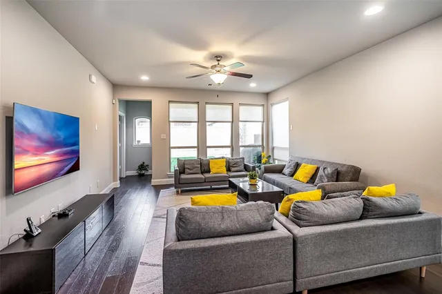 a living room with furniture and a flat screen tv