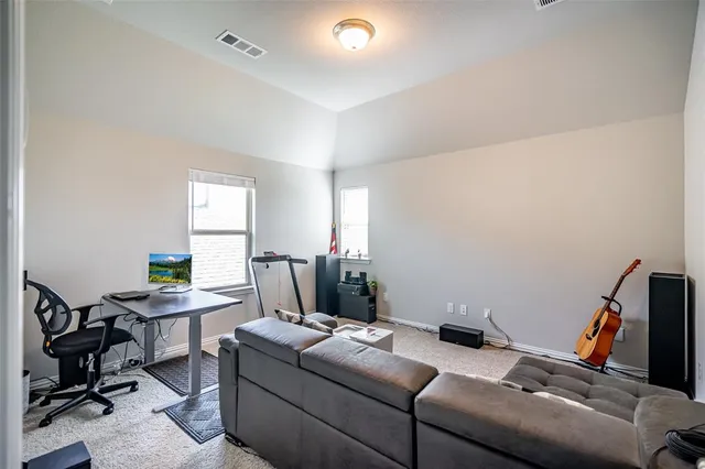 a work room with furniture and windows