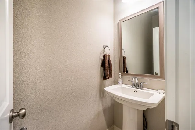 a bathroom with a sink and mirror
