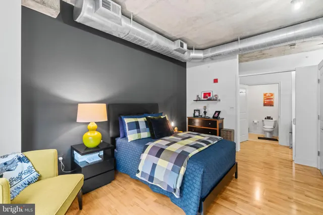 a bedroom with a bed and couch