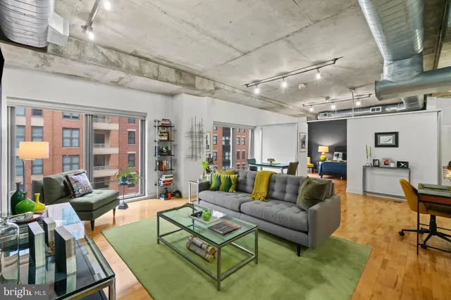 a living room with furniture and a table