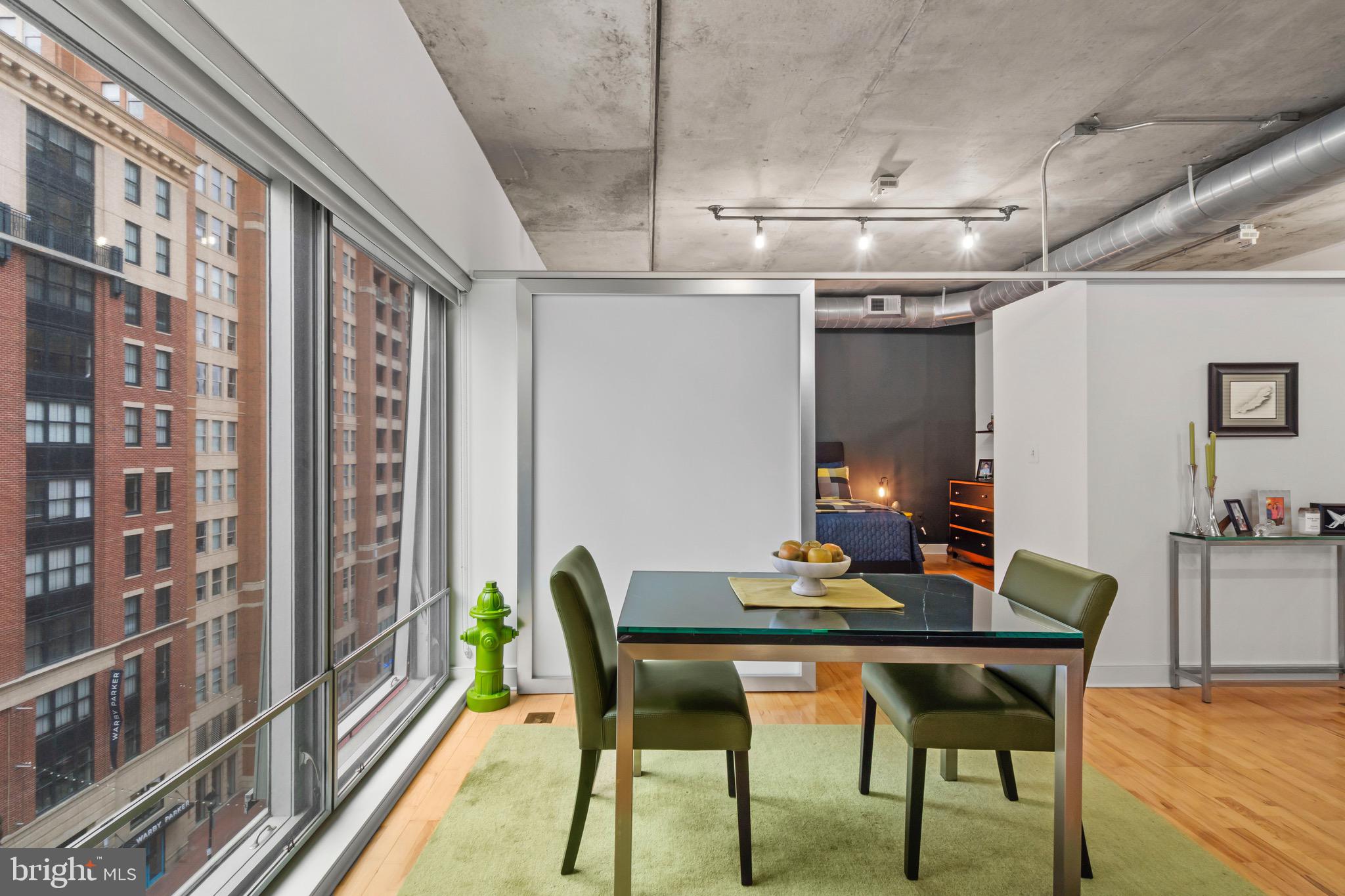 850 Aliceanna Street, Unit 604 Baltimore, MD 21202 - Photo 8 of 43 a dining room with a table and chairs