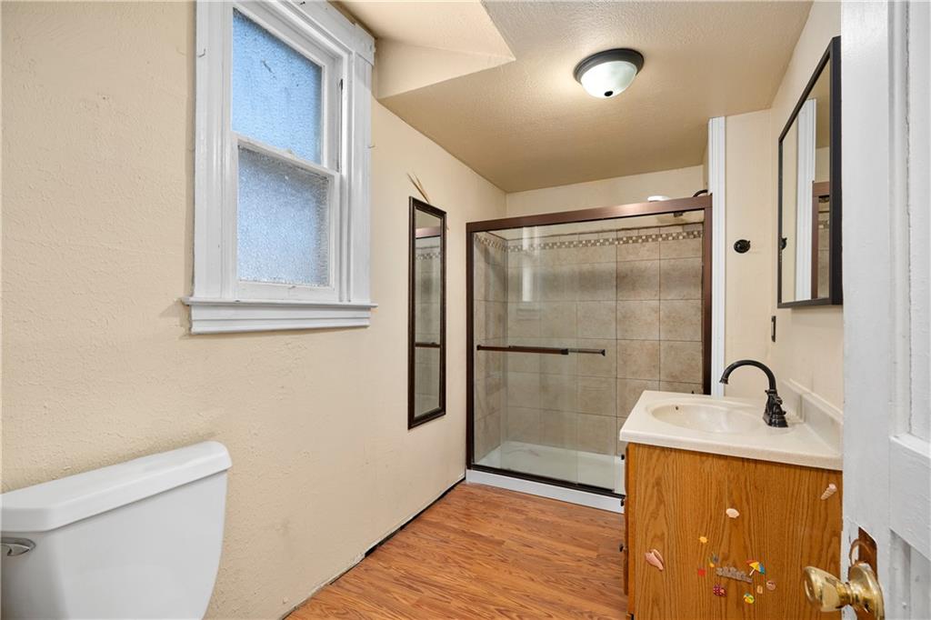 10 Alice Street McKees Rocks, PA 15136 - Photo 8 of 16 a bathroom with a sink a toilet and shower