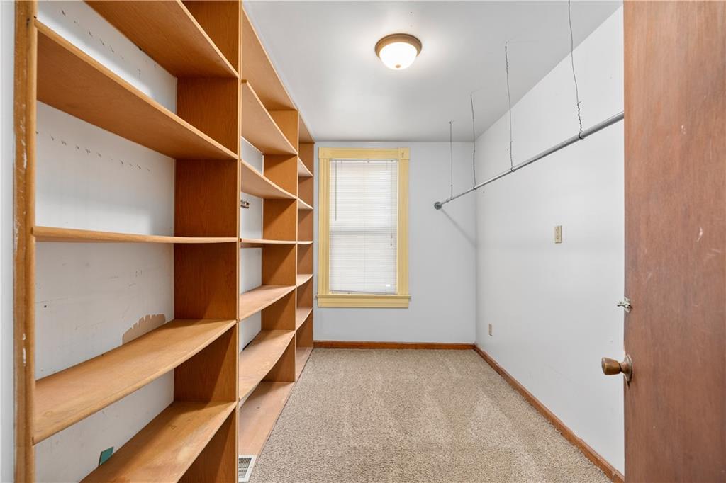 10 Alice Street McKees Rocks, PA 15136 - Photo 10 of 16 a view of walk in closet with empty racks
