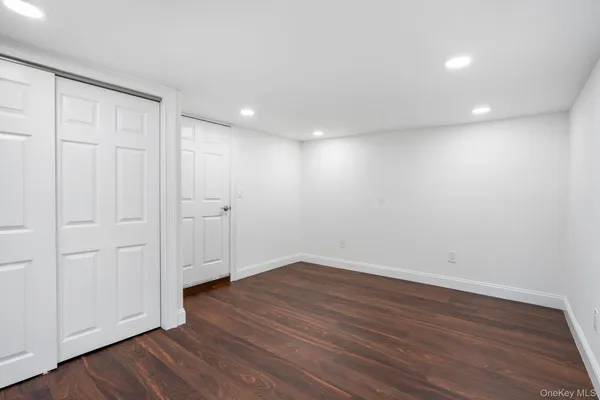 a view of wooden floor in an empty room