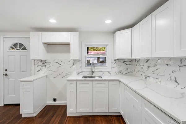 a kitchen with a sink and cabinets