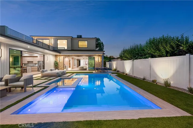 a view of swimming pool with seating area and furniture