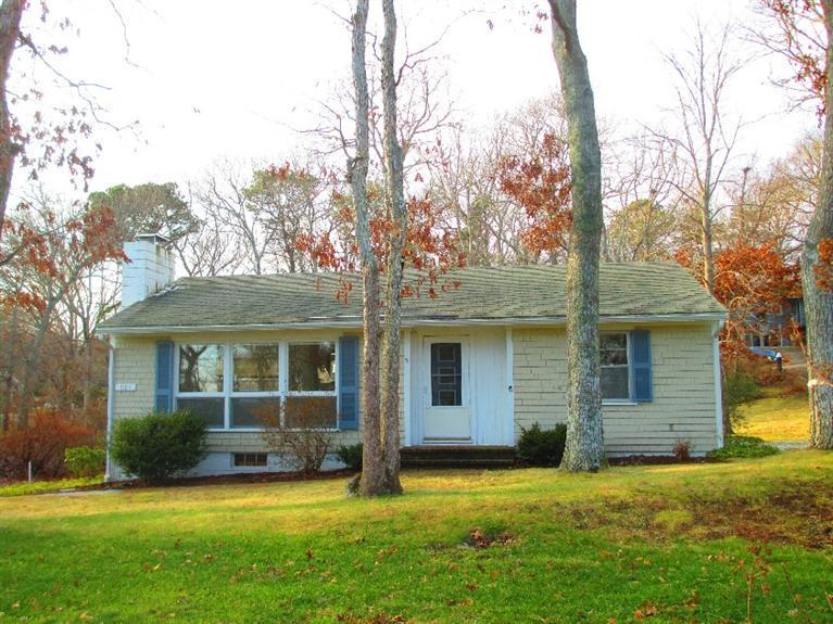 587 Shootflying Hill Road Centerville, MA 02632 - Photo 3 of 30 a view of a house with a yard