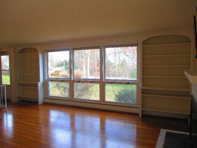 587 Shootflying Hill Road Centerville, MA 02632 - Photo 6 of 30 wooden floor in an empty room with a window
