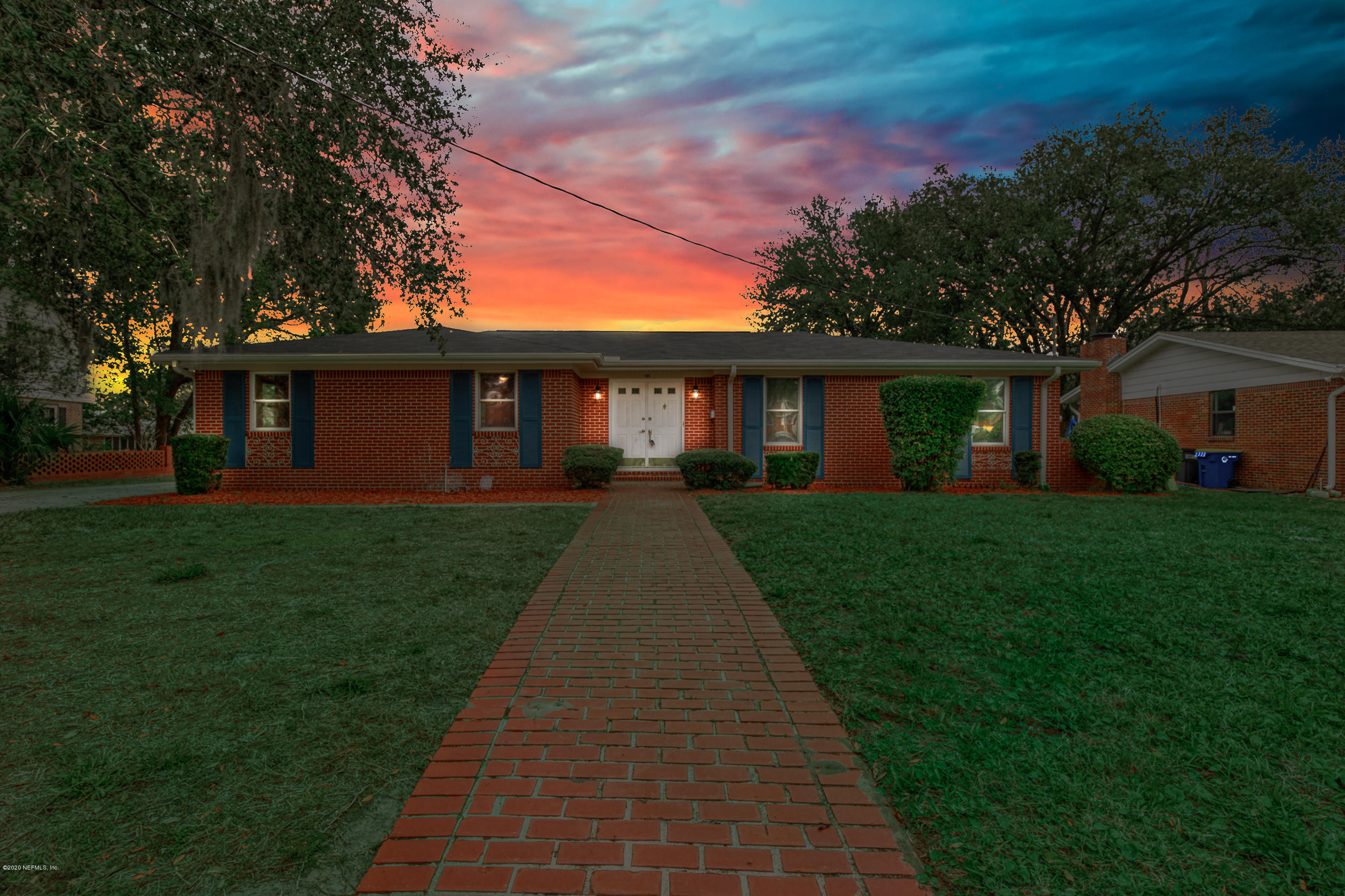 1305 Timber Lane Jacksonville, FL 32211 - Photo 1 of 58 a front view of a house with a yard