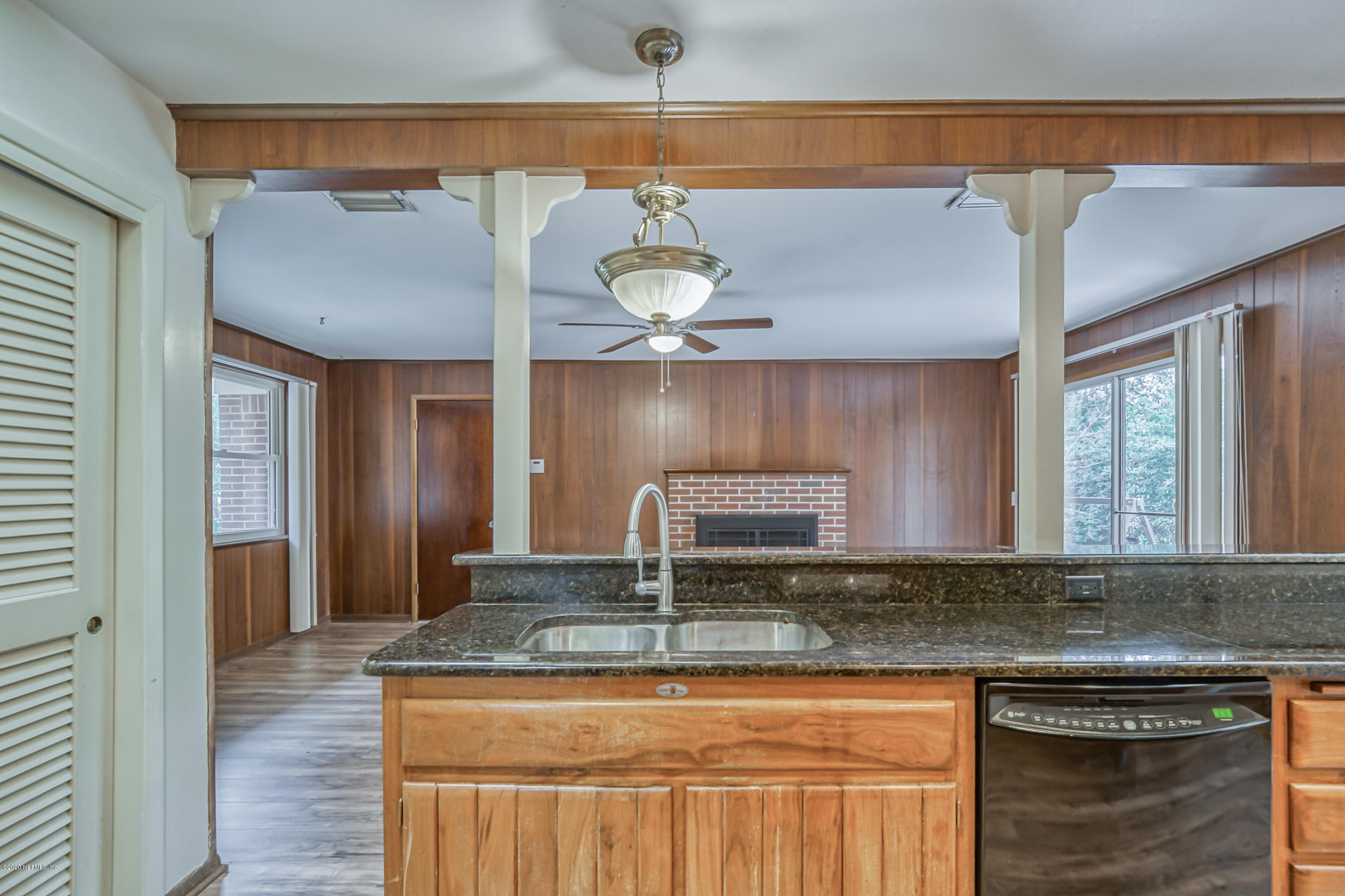 1305 Timber Lane Jacksonville, FL 32211 - Photo 11 of 58 a kitchen with kitchen island granite countertop a sink and a cabinets
