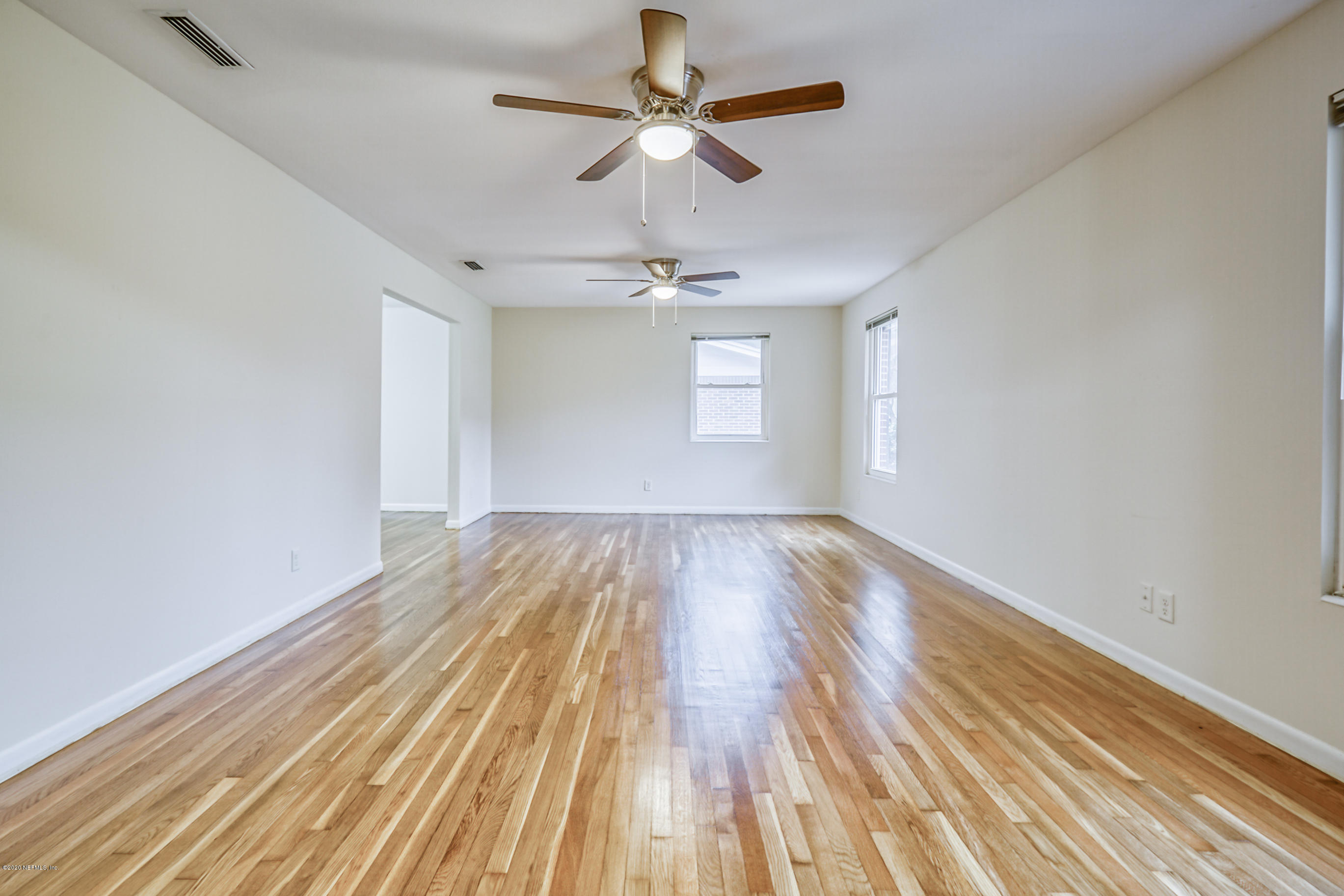 1305 Timber Lane Jacksonville, FL 32211 - Photo 17 of 58 a view of empty room with wooden floor