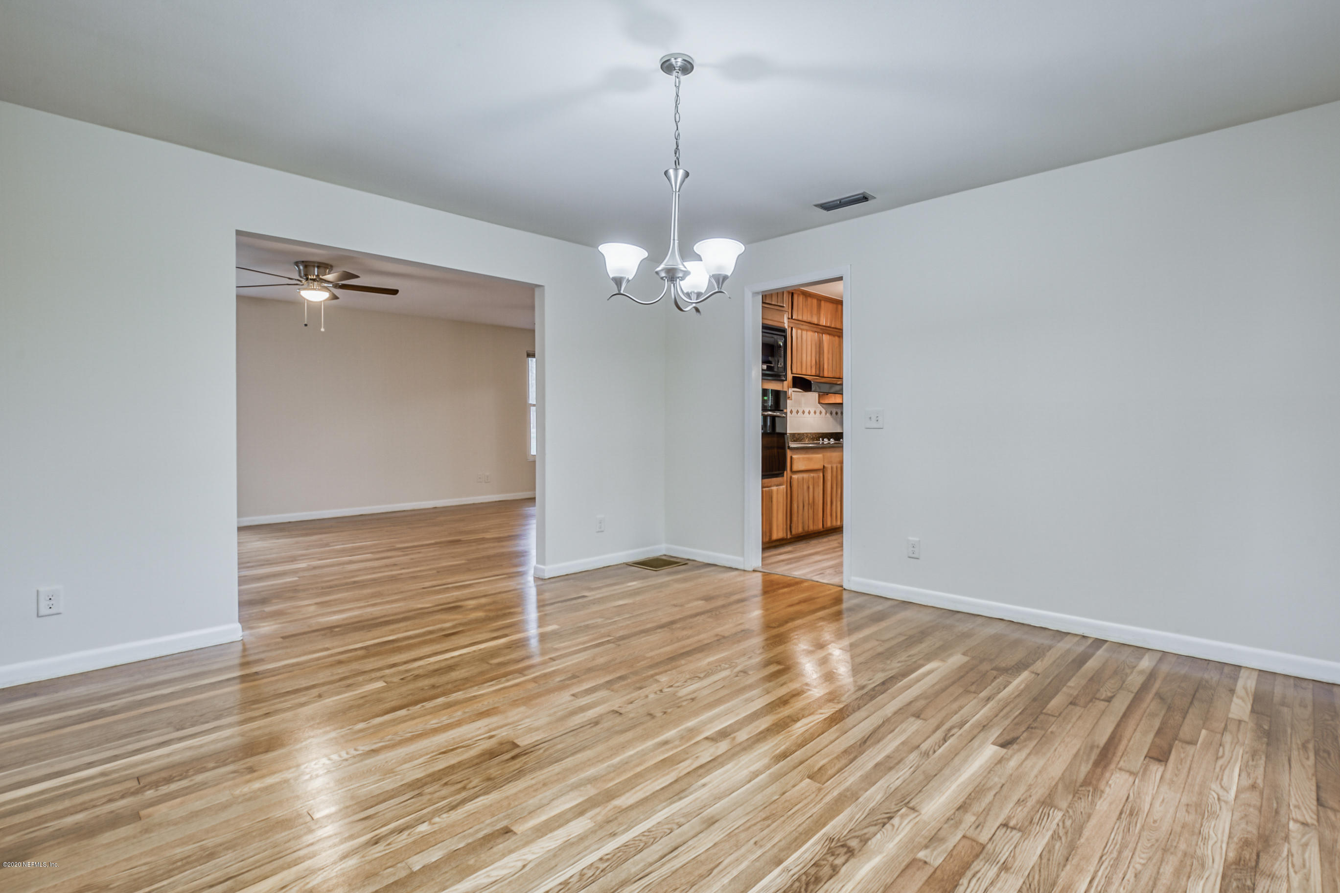 1305 Timber Lane Jacksonville, FL 32211 - Photo 24 of 58 wooden floor in an empty room with a window