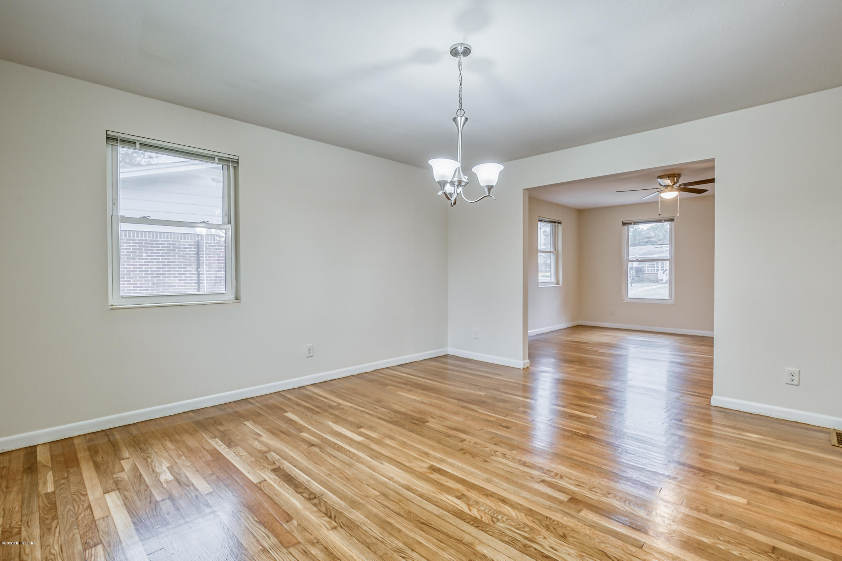 1305 Timber Lane Jacksonville, FL 32211 - Photo 25 of 58 a view of empty room with wooden floor and fan