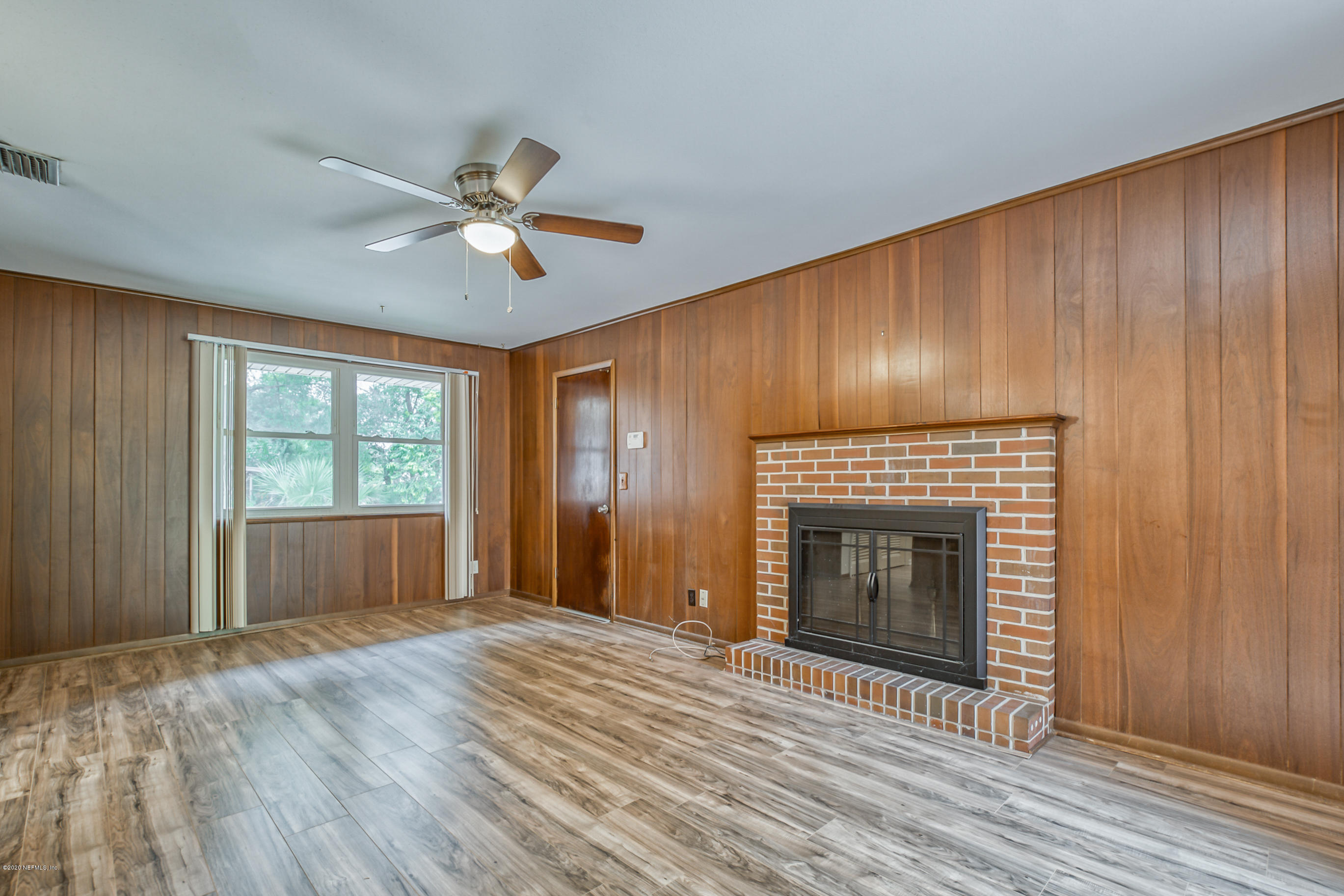 1305 Timber Lane Jacksonville, FL 32211 - Photo 28 of 58 a view of an empty room with a fireplace and a window