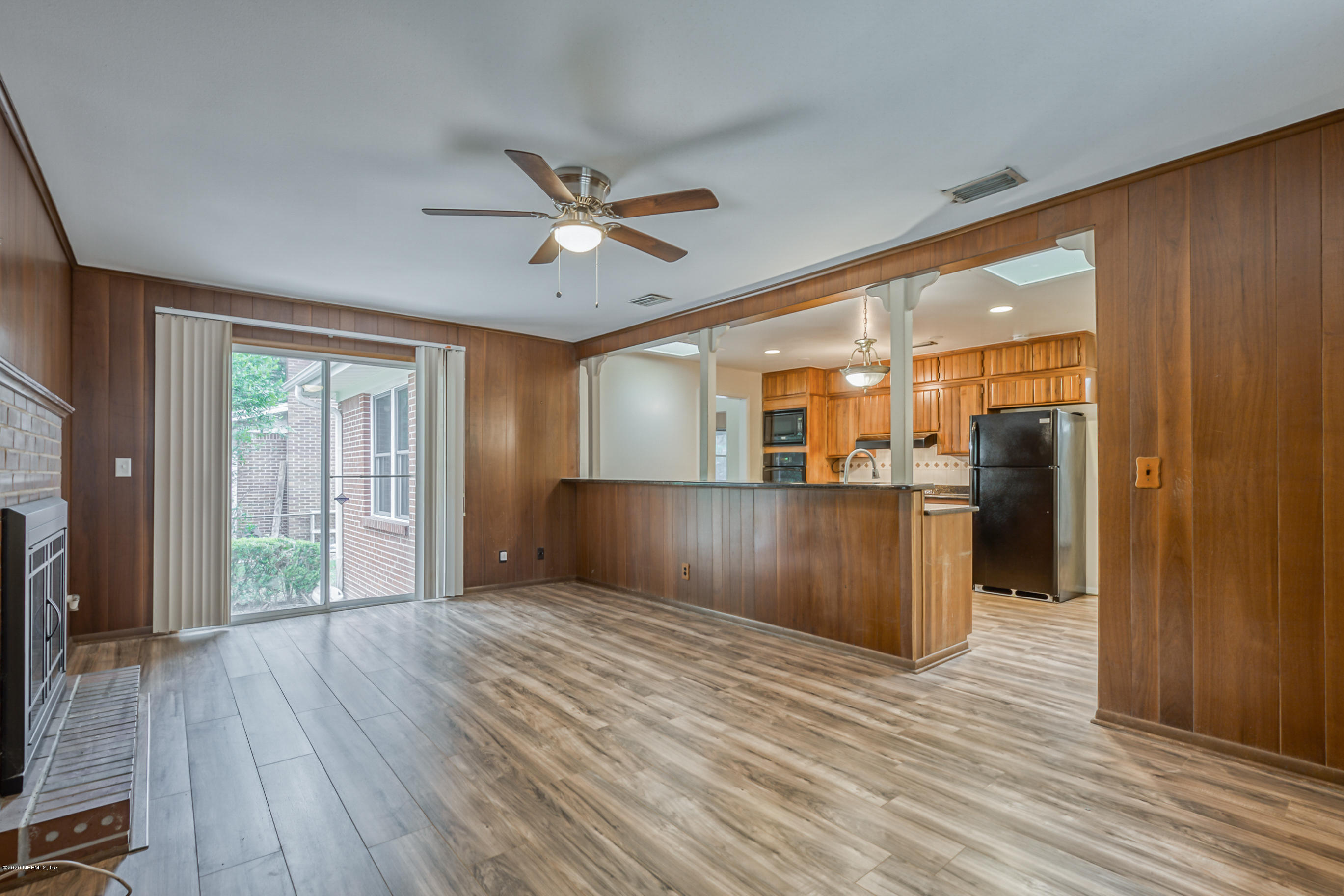 1305 Timber Lane Jacksonville, FL 32211 - Photo 30 of 58 a big room with wooden floor and windows